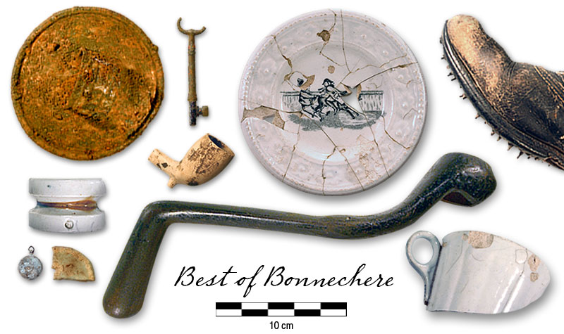 Photo of pipe bowl, caulked boot, teacup, key, Jasperware lid, child's plate, tea kettle lid, stove grate wrench, insulator